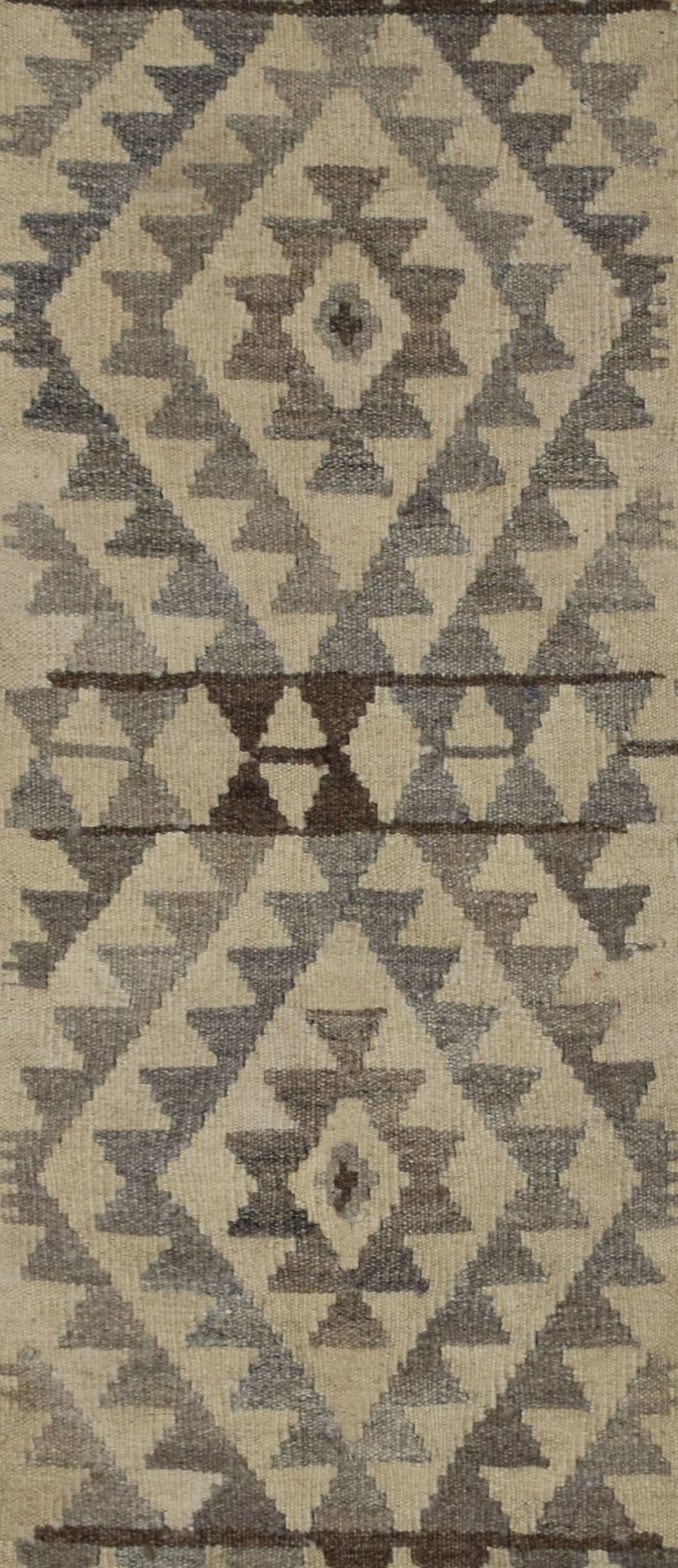 Handmade Afghan Maimana kilim rug featuring a geometric pattern in natural undyed wool tones.