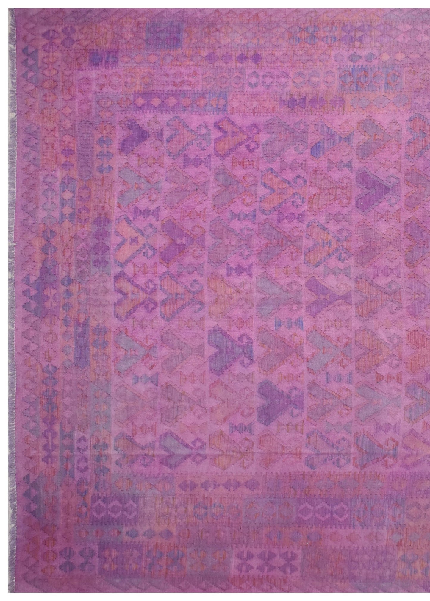 Handmade Afghan Maimana kilim rug featuring a geometric pattern in shades of pink and purple.