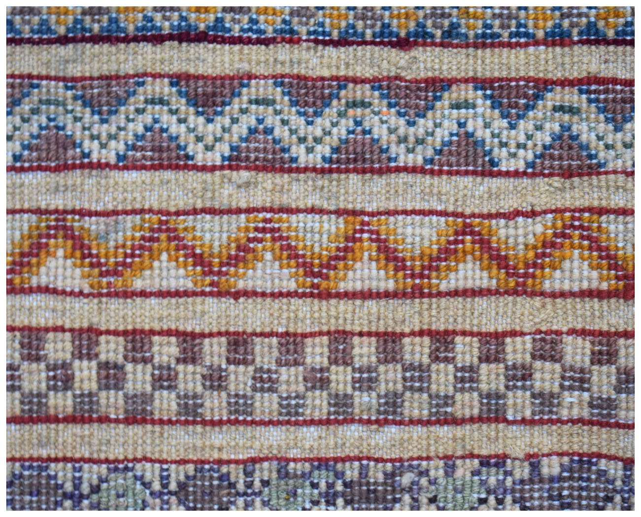 A close-up of an Afghan Yekta runner featuring horizontal bands of geometric and checkered patterns.