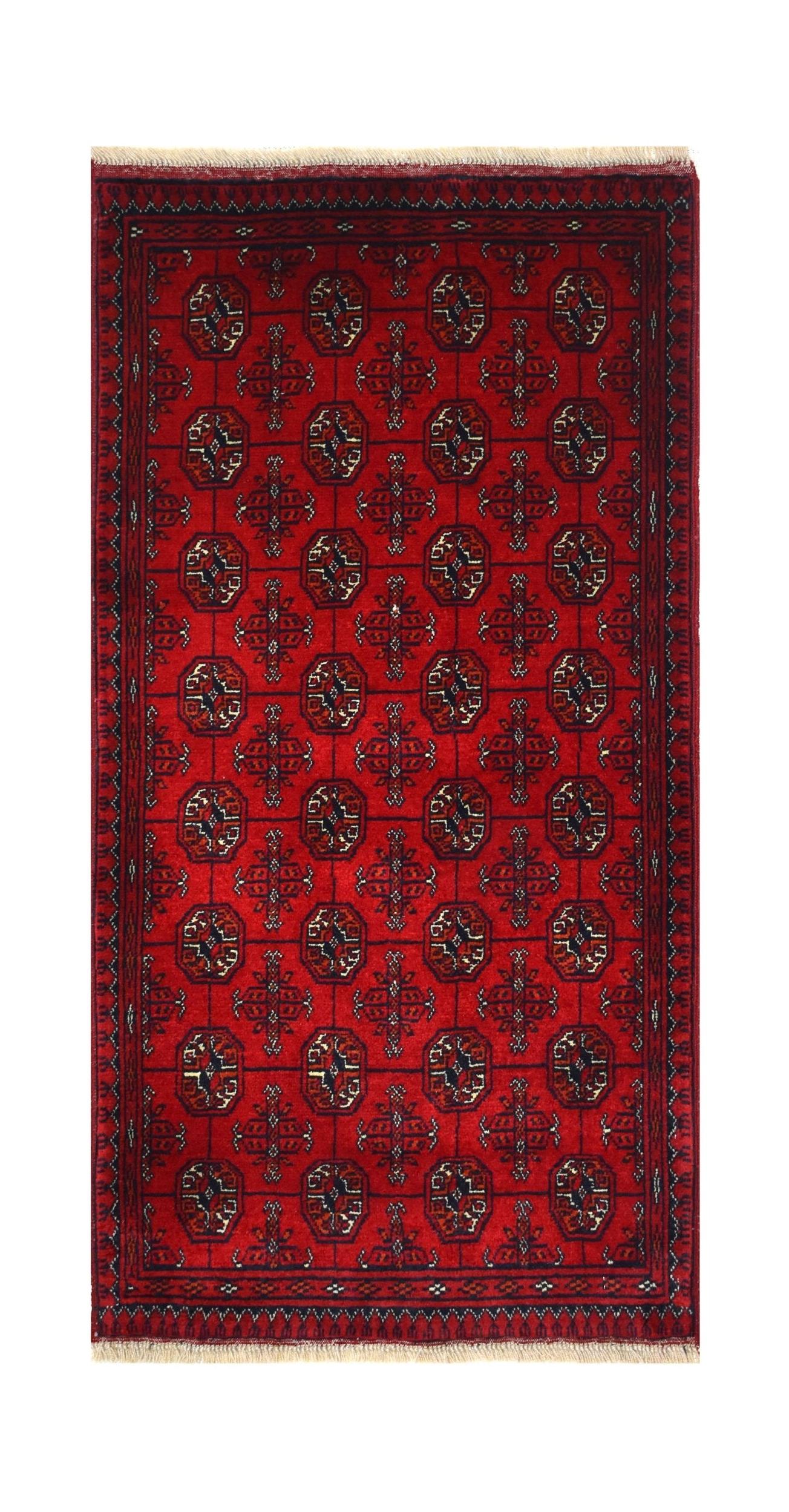 A rectangular handmade Afghan Biljik rug featuring a deep red field with repeating geometric motifs.