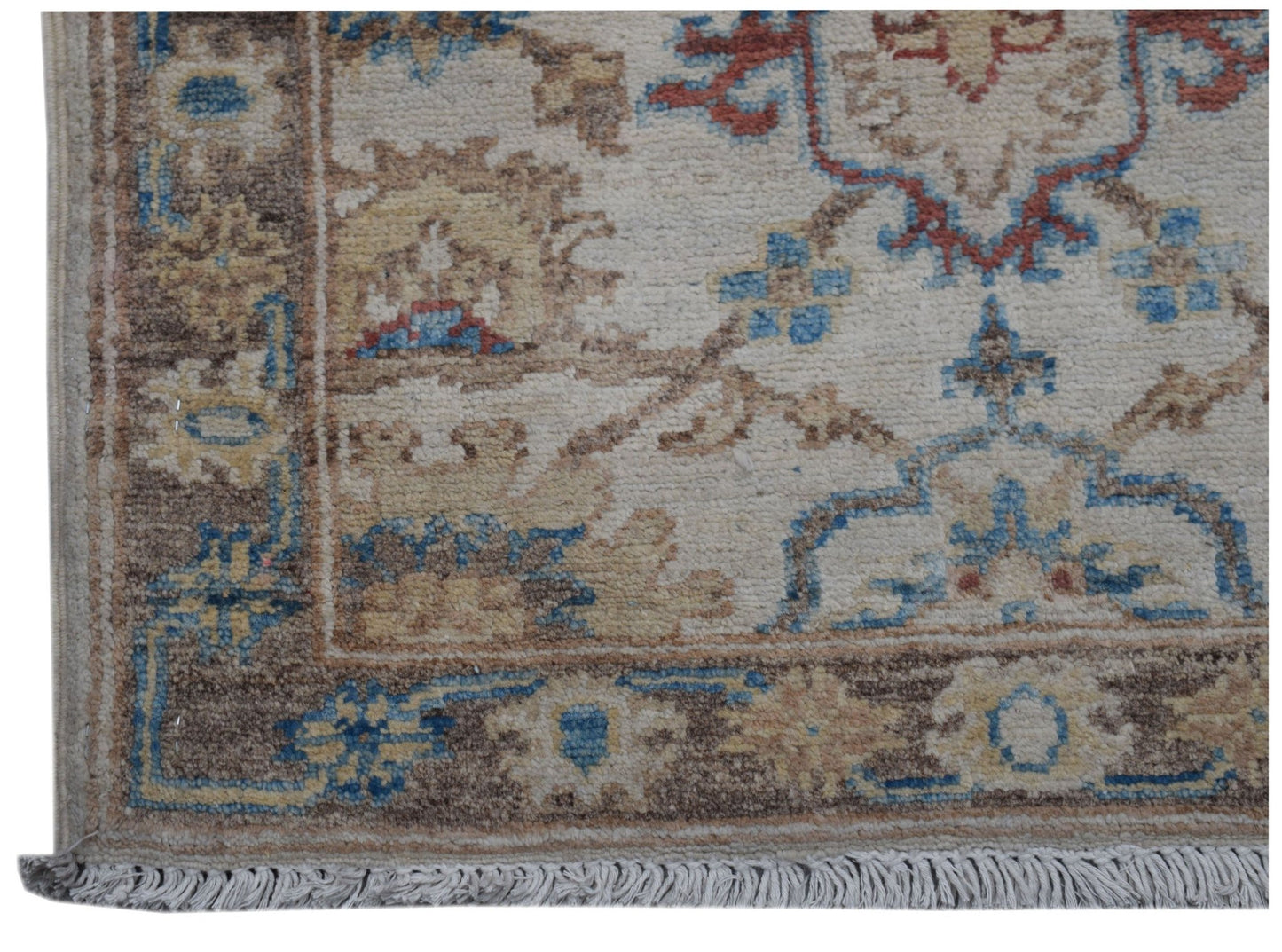 A handmade Afghan Chobi rug featuring a traditional floral pattern in blue, red, and beige tones.