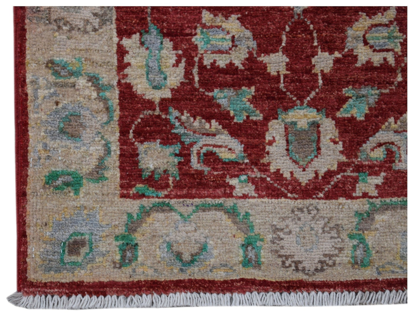 A handmade Afghan Chobi rug featuring a red field with floral patterns and a beige border.