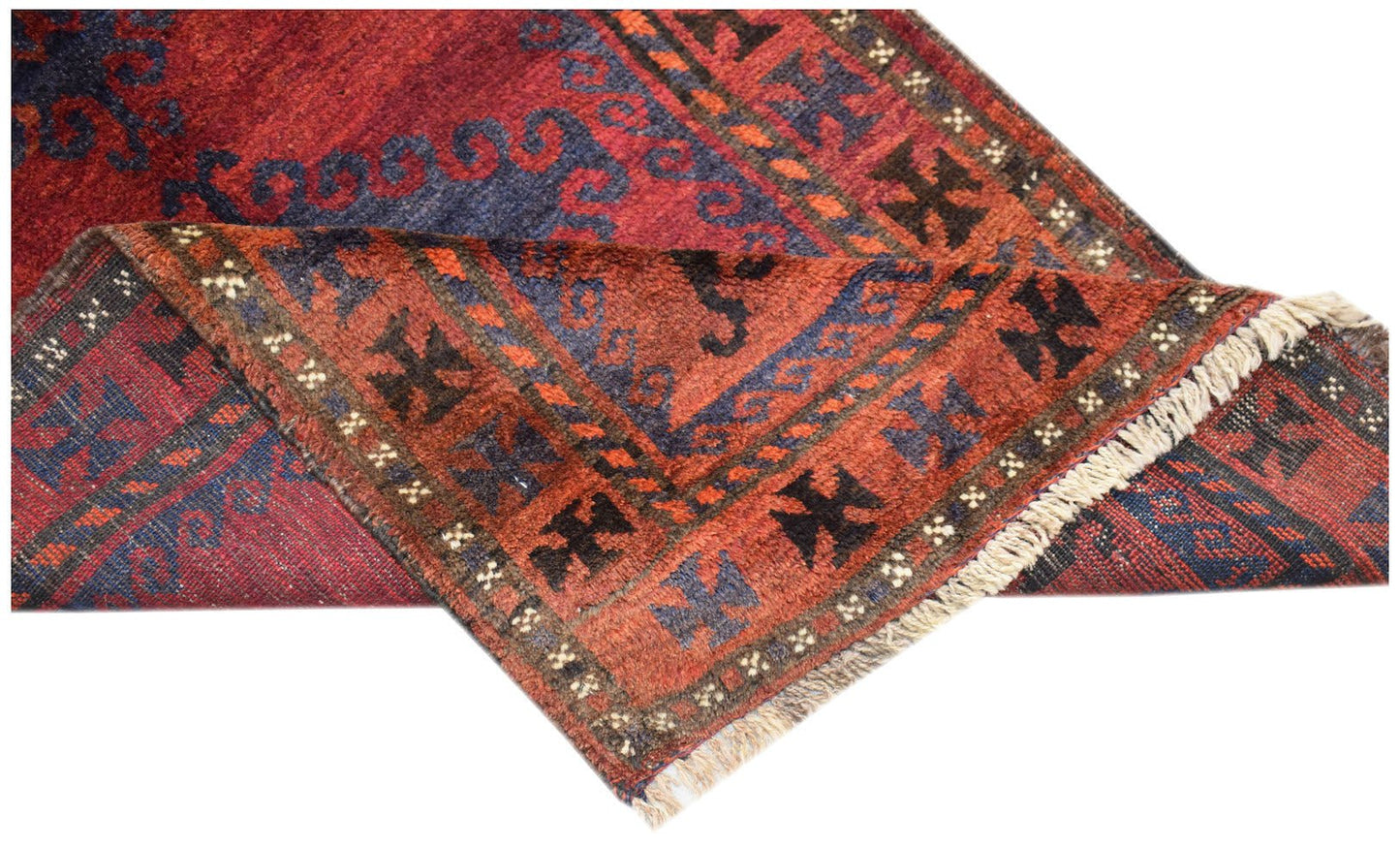 A vintage handmade Afghan Baluch rug featuring traditional geometric patterns in red and blue.