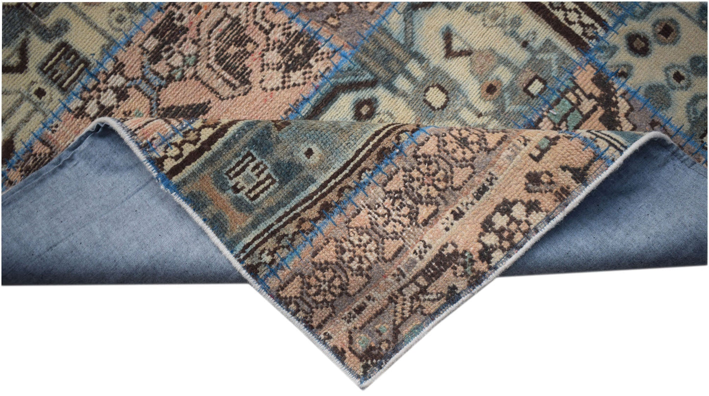A handmade vintage patchwork runner featuring wool patterns in blue and beige on a cotton base.