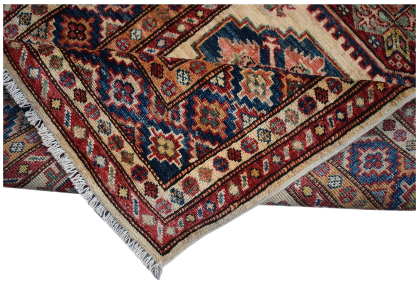 An Afghan Super Kazakh runner featuring traditional geometric motifs in red, blue, and cream wool.