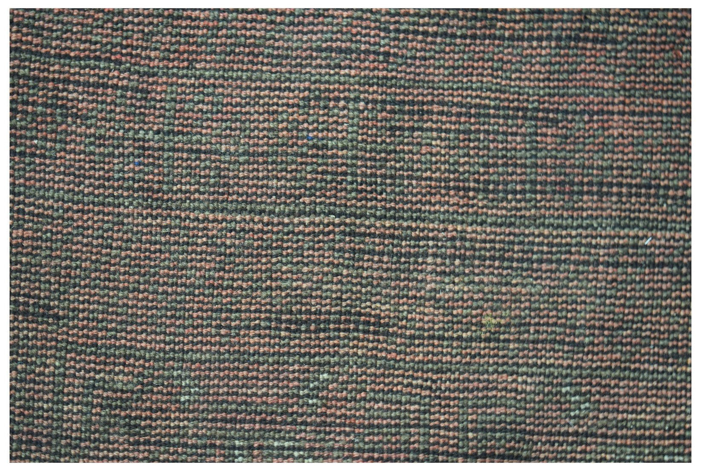 A handmade Afghan Baluch rug featuring a textured, horizontal striped pattern in earthy tones.