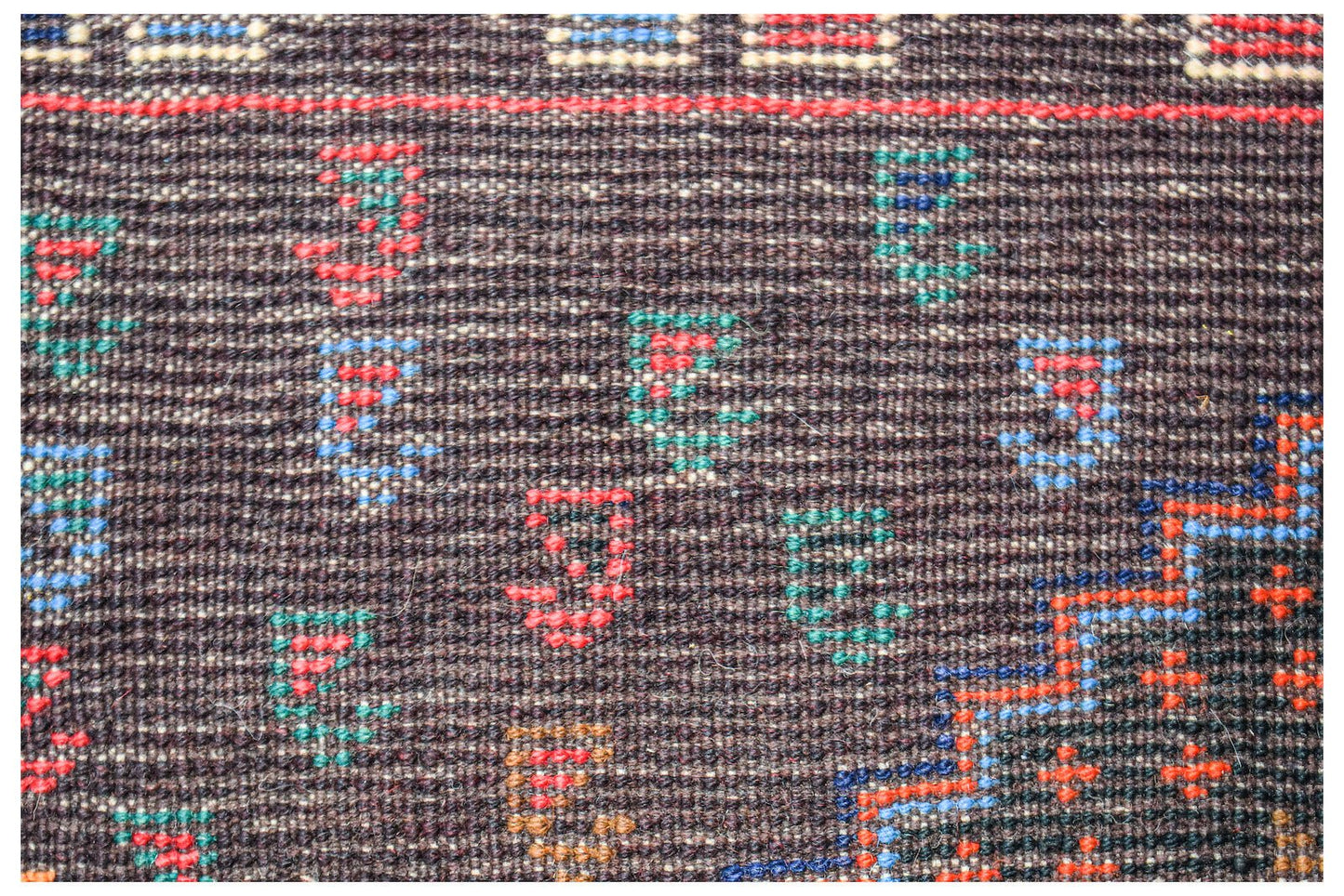 Handmade Afghan Pashm rug featuring a dark brown wool base with colorful geometric tribal motifs.