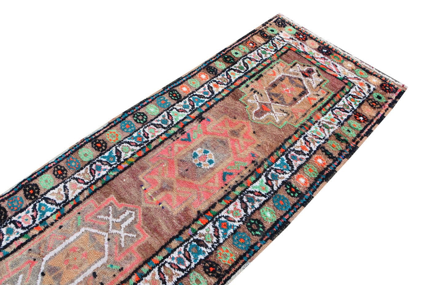 A vintage Kurdish Herki runner featuring tribal motifs in vibrant neon colors on a brown wool base.