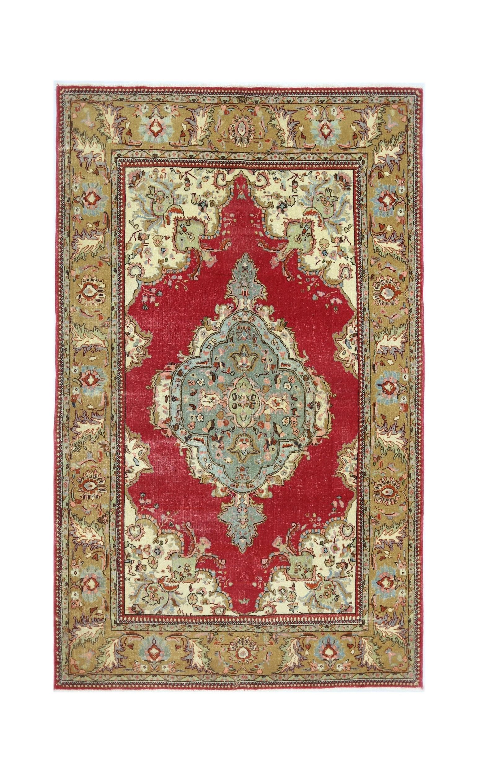 A vintage Persian Bidjar rug featuring a central blue medallion on a red field with a tan border.