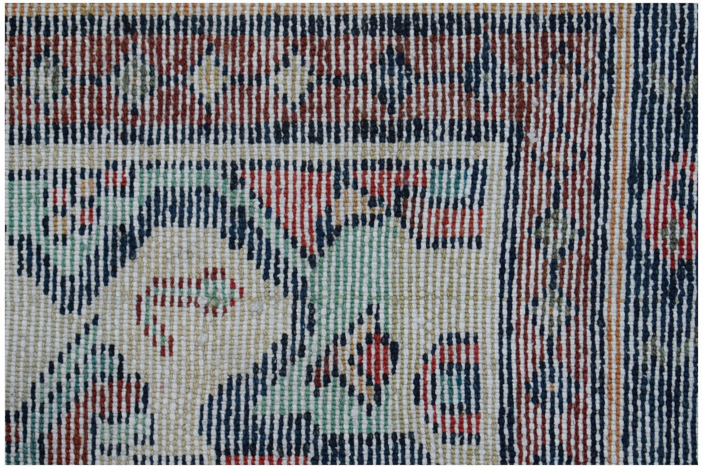 A close-up of a handwoven vintage Persian runner featuring intricate geometric patterns in wool.