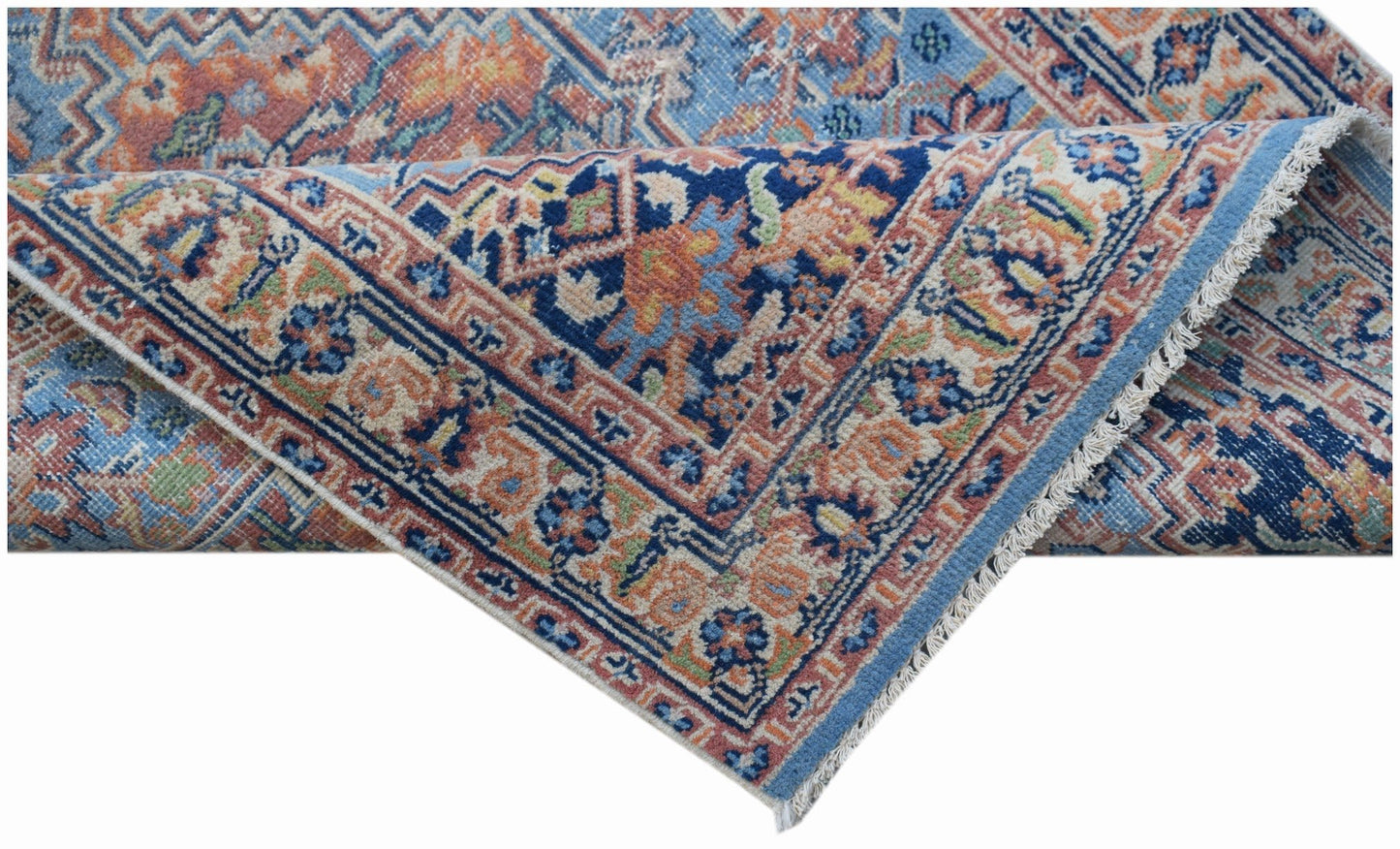 A handwoven vintage Persian runner featuring a traditional floral pattern in blue and orange tones.