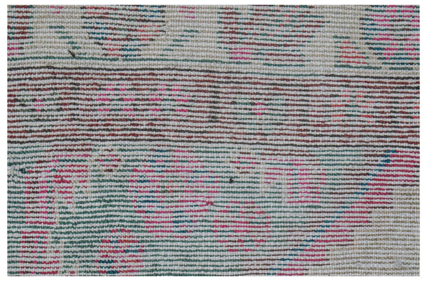 A close-up of a vintage Persian rug featuring a faded, multi-colored striped pattern.