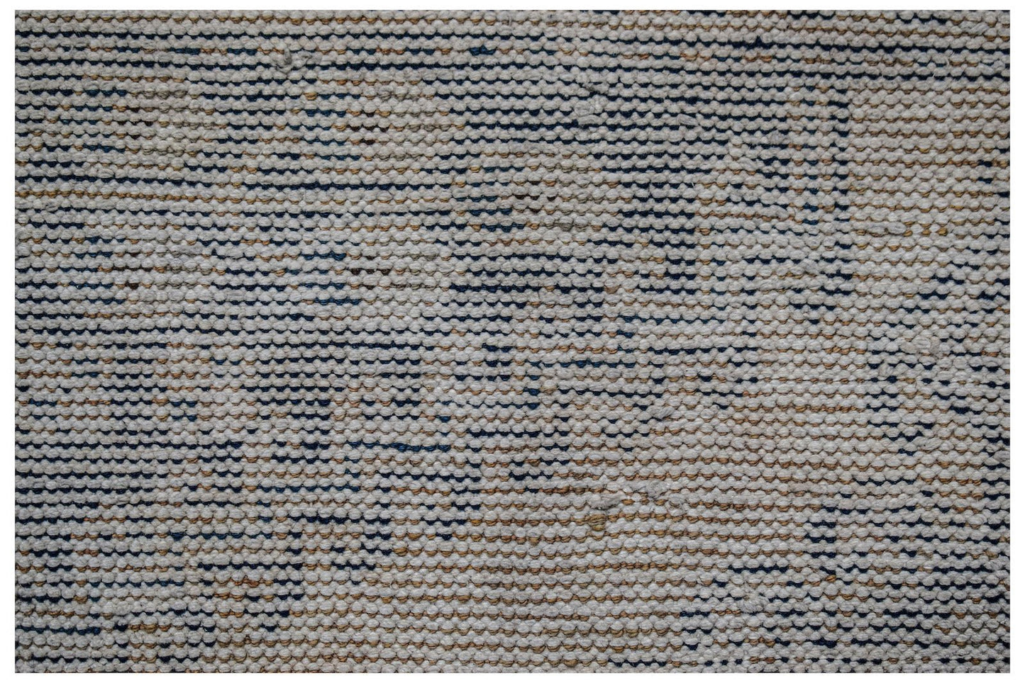 A close-up view of a handwoven vintage Persian rug featuring a textured, distressed wool pattern.