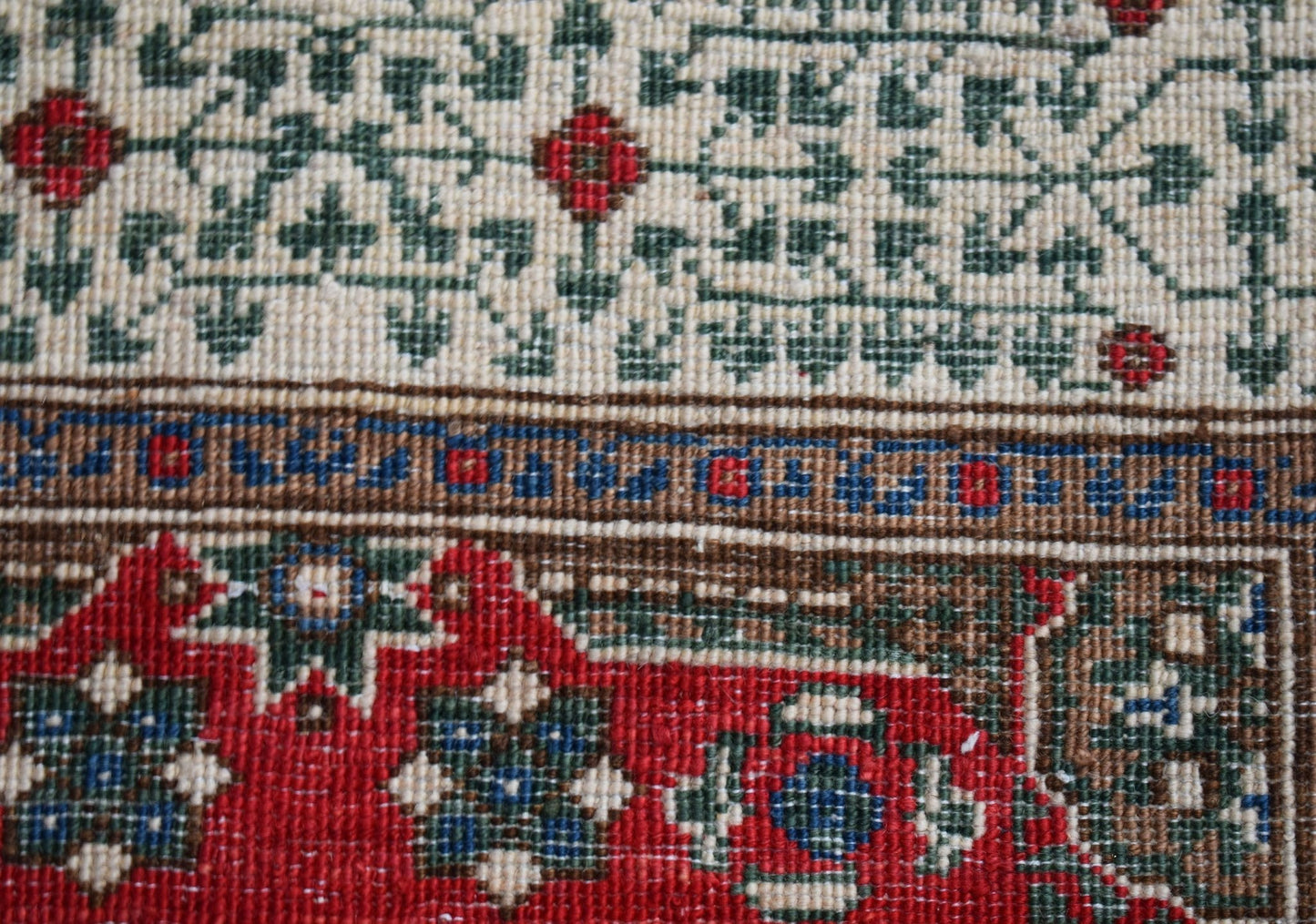 A close-up of a handwoven Afghan Chobi runner featuring a traditional Mamluk geometric pattern.