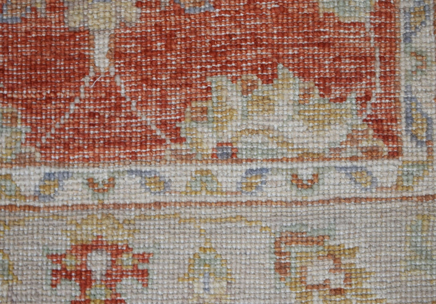 A close-up view of a handwoven Afghan Chobi runner featuring traditional patterns in earthy tones.