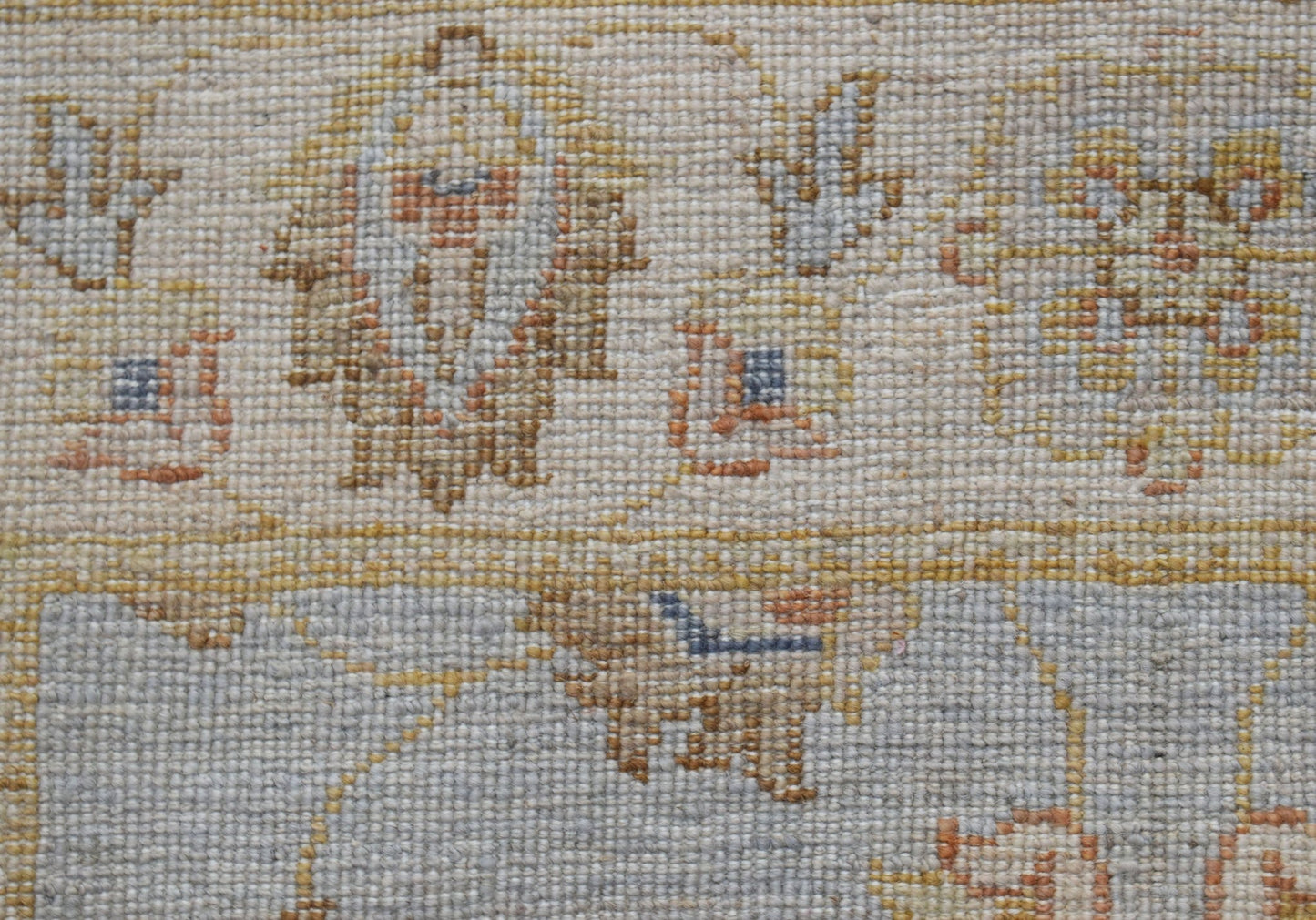 A close-up of an Afghan Chobi runner featuring intricate traditional patterns in earthy tones.