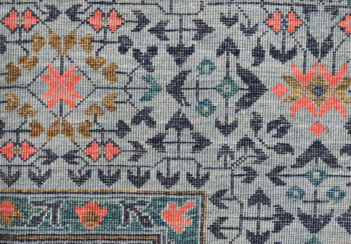 A handwoven Afghan Chobi rug featuring a detailed Mamluk pattern in blue, coral, and gold tones.