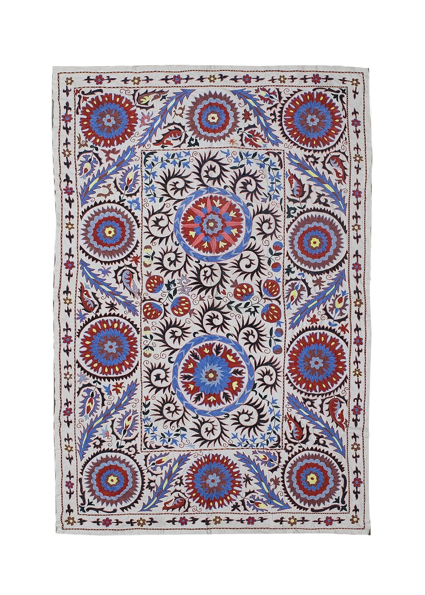A rectangular Uzbek suzani featuring intricate floral and circular embroidery on a cotton base.