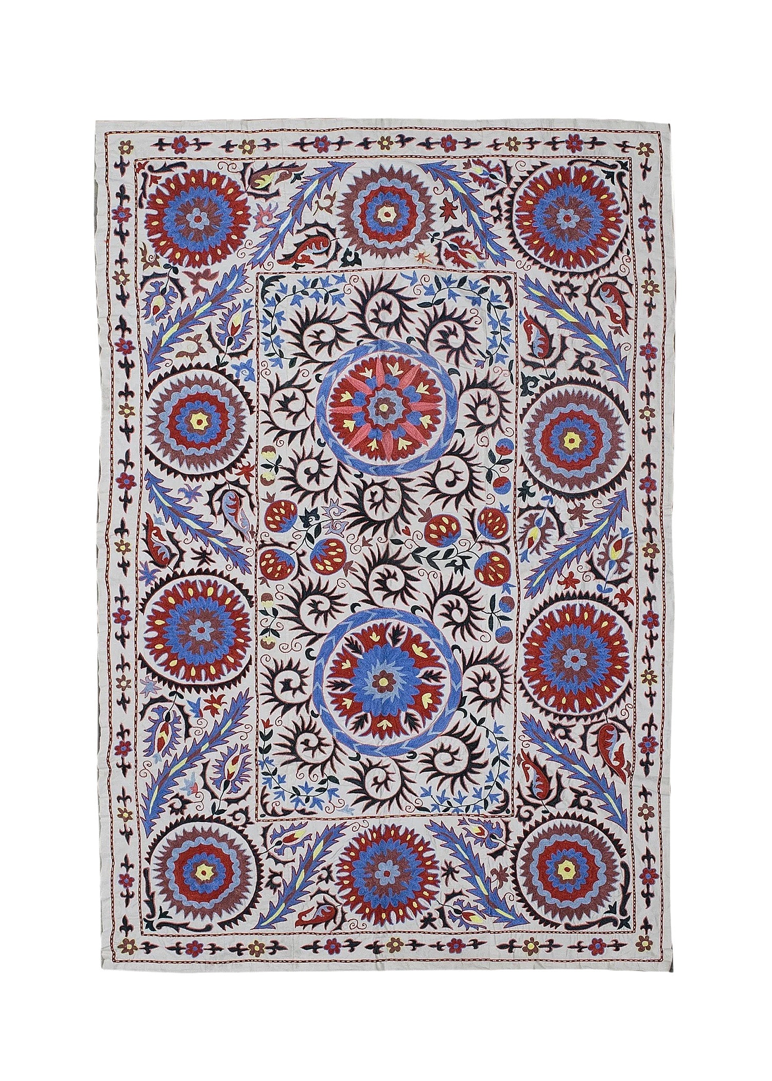 A rectangular Uzbek suzani featuring intricate floral and circular embroidery on a cotton base.