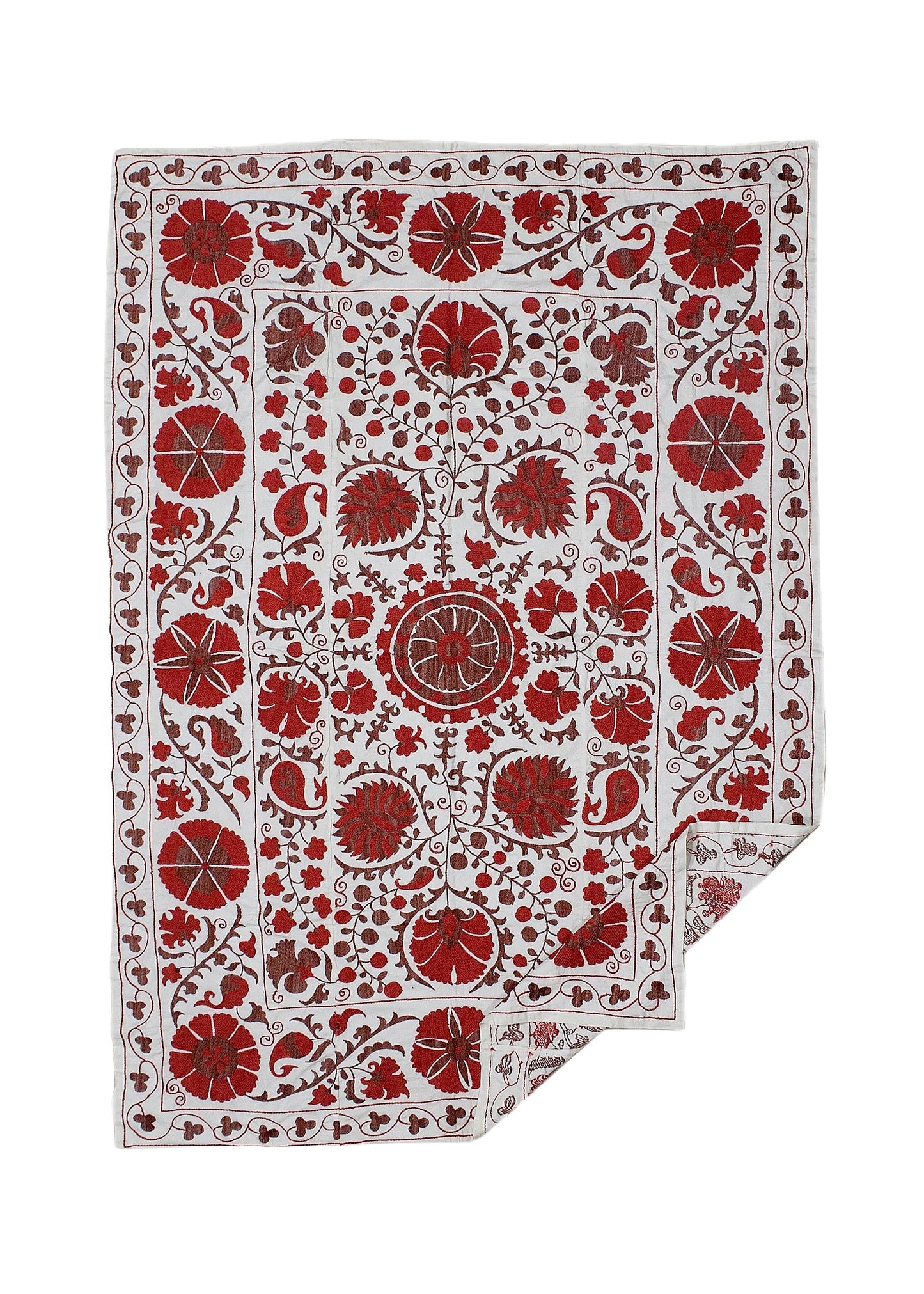 A rectangular Uzbek suzani featuring intricate red floral embroidery on a white cotton background.