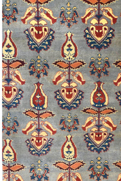 An Afghan Chobi runner featuring a repeating floral motif in red, blue, and cream on a grey field.