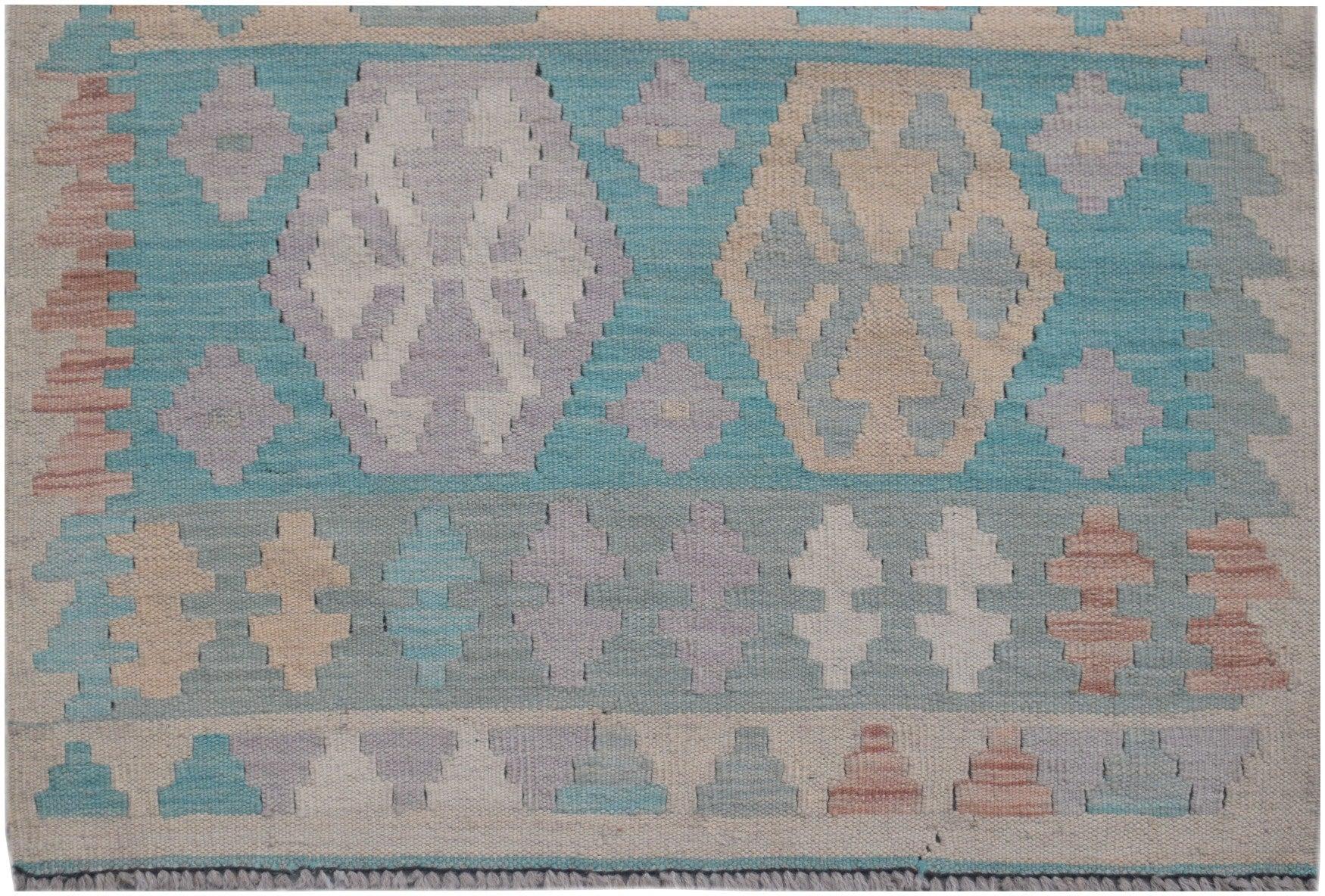 Handmade Afghan Maimana kilim runner featuring geometric patterns in soft blue, tan, and purple.