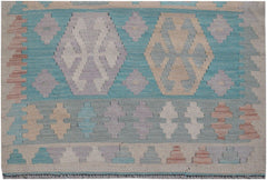 Handmade Afghan Maimana kilim runner featuring geometric patterns in soft blue, tan, and purple.