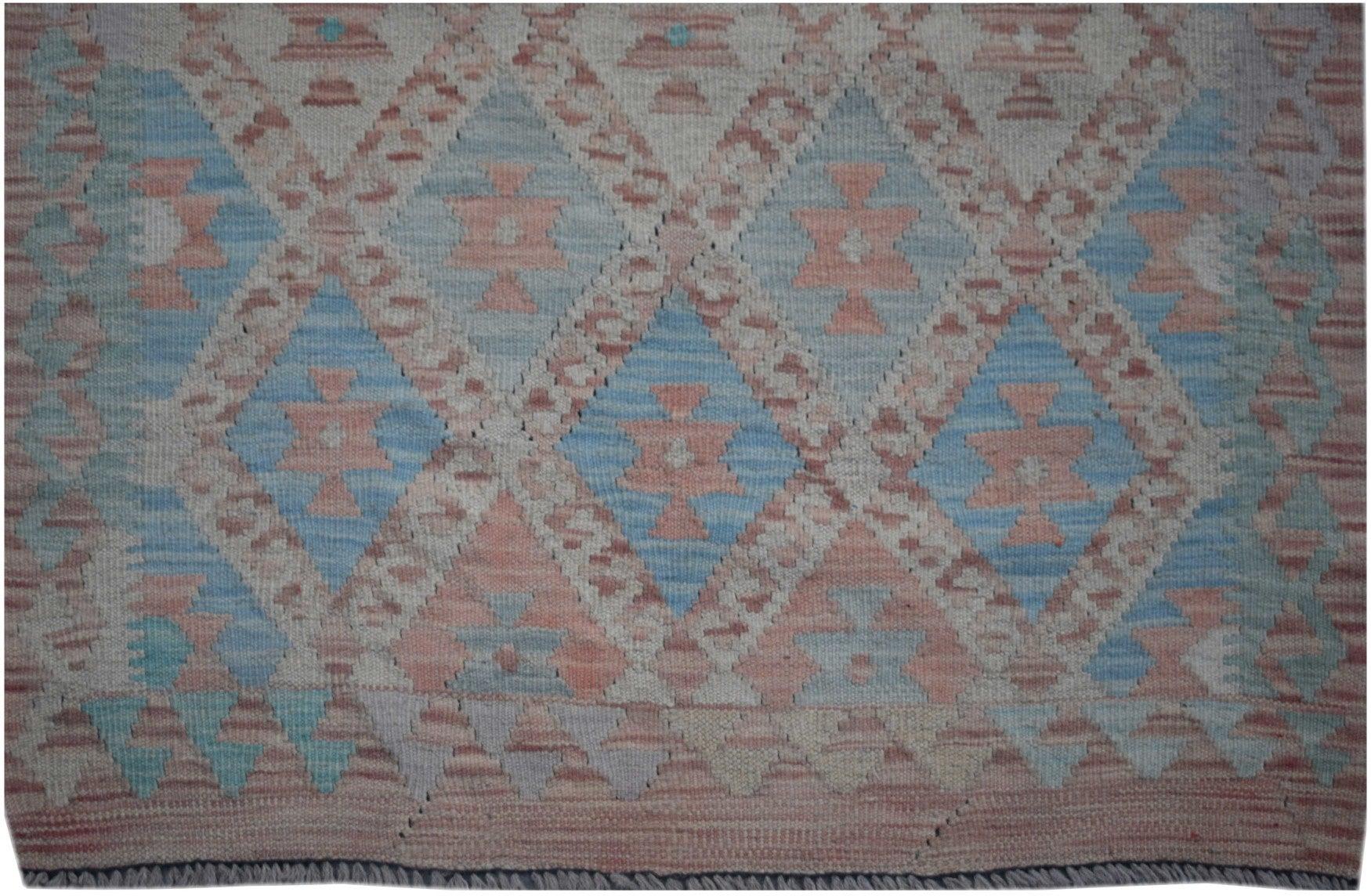 Handmade Afghan Maimana kilim runner featuring a geometric diamond pattern in blue and peach tones.