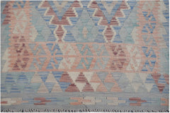Handmade Afghan Maimana kilim runner featuring a geometric pattern in blue, pink, and cream wool.