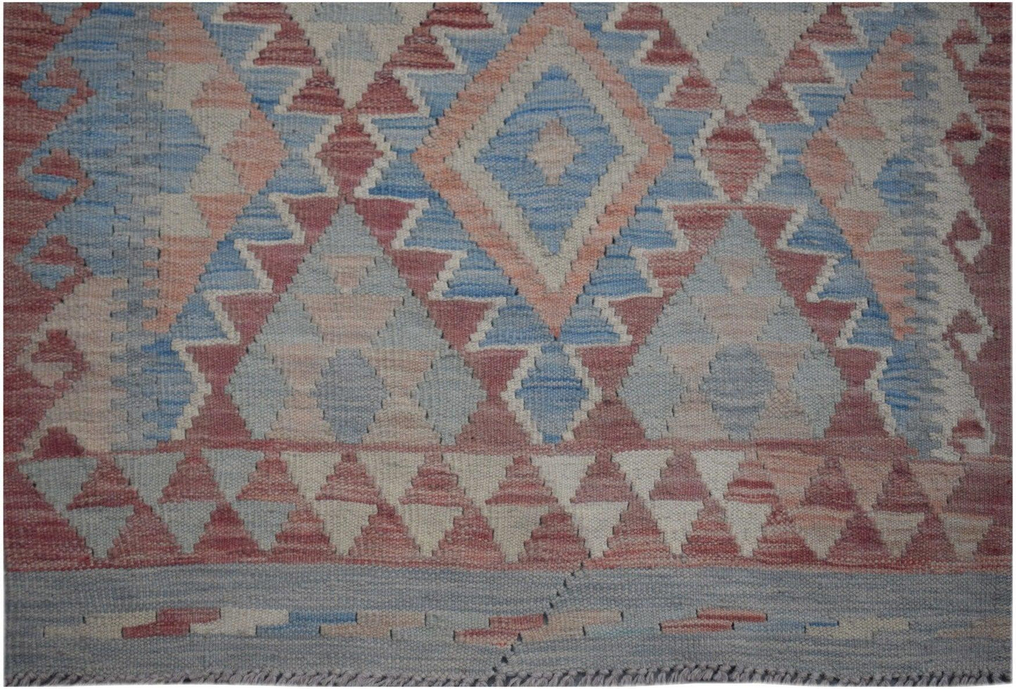 Handmade Afghan Maimana kilim runner featuring a geometric diamond pattern in blue and red wool.