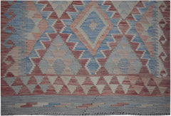 Handmade Afghan Maimana kilim runner featuring a geometric diamond pattern in blue and red wool.