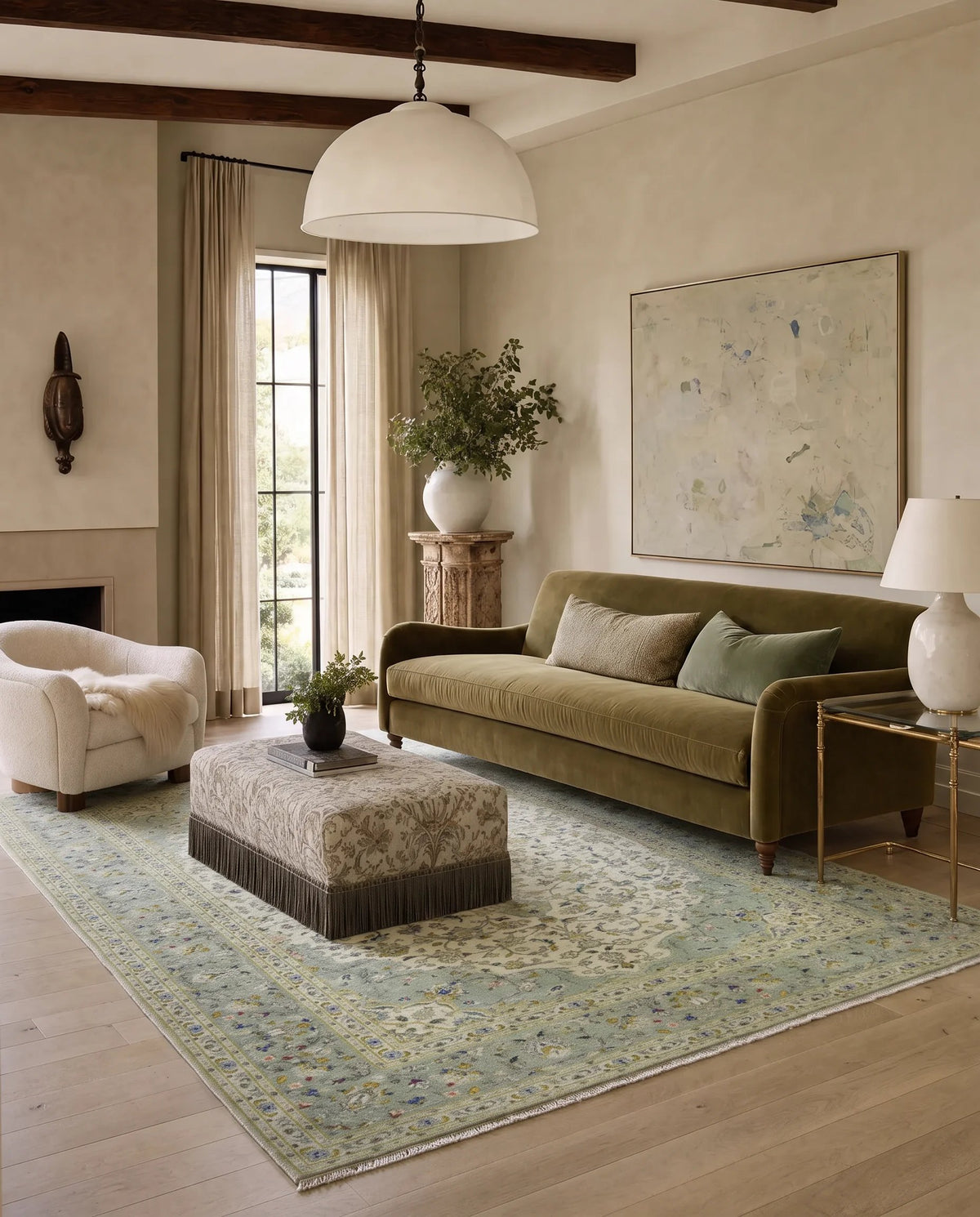 Vintage Persian Kashan rug with a soft green floral pattern and central medallion in a warm, styled living room.
