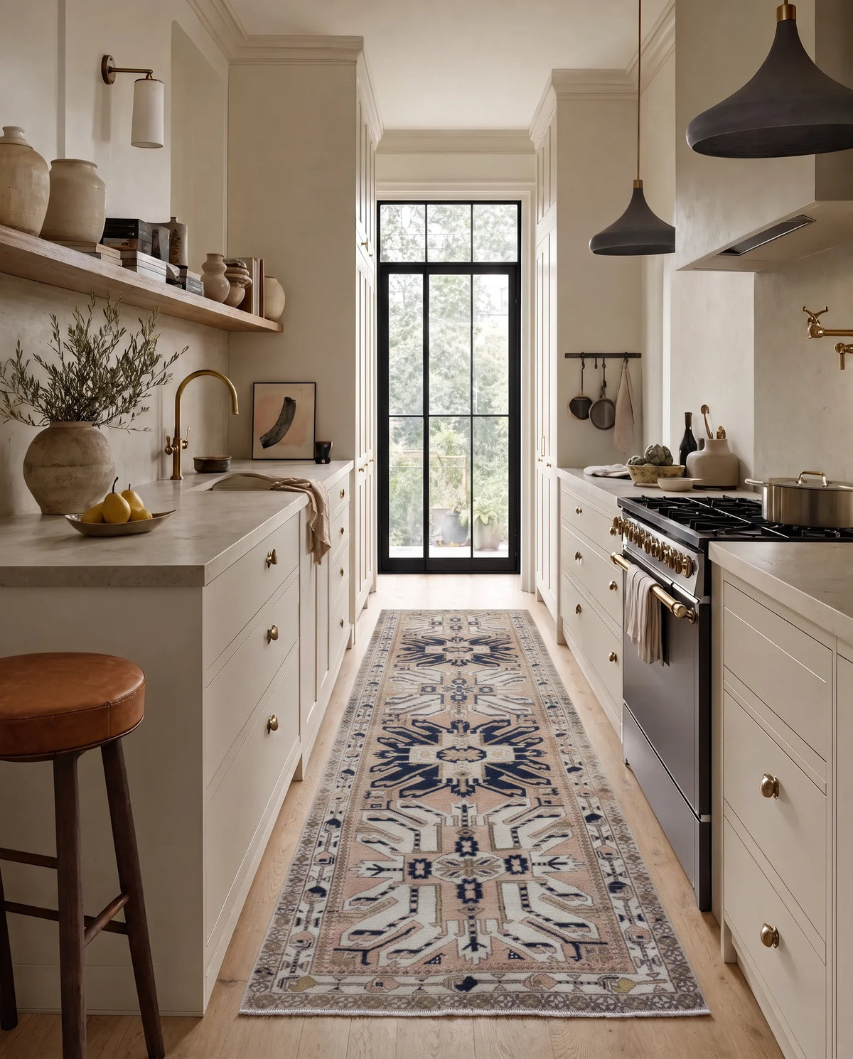 Vintage Caucasian Kazak runner with geometric blue and cream medallions on a light pink field, styled in a modern kitchen.