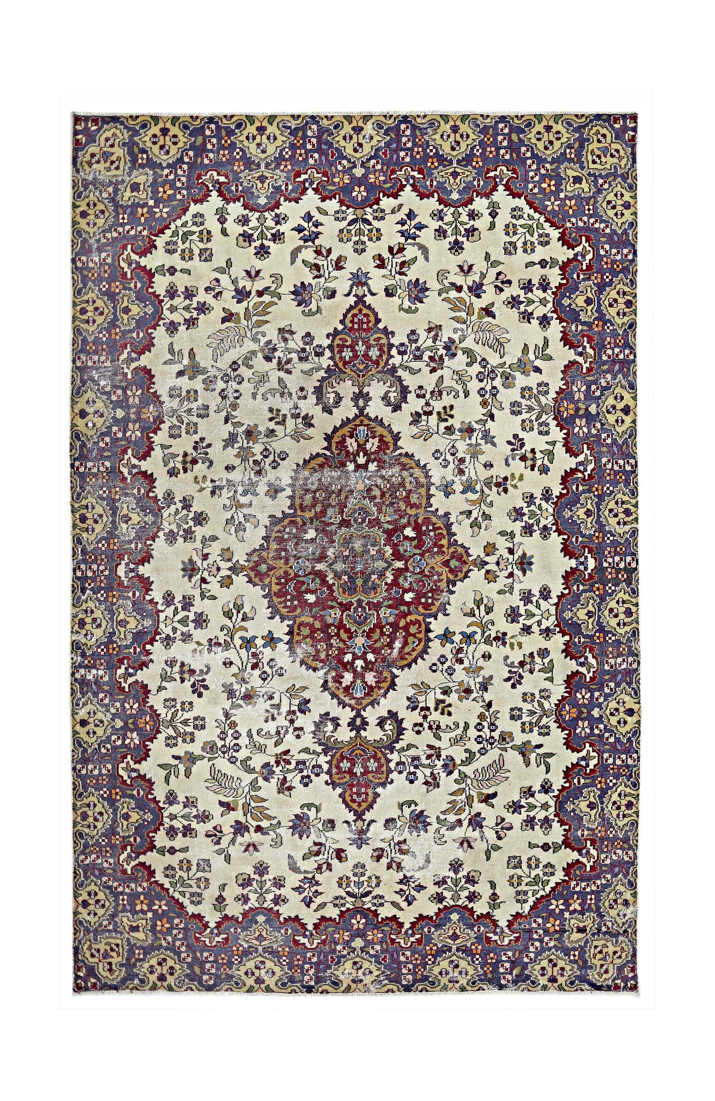 A vintage Persian Kerman rug featuring a central medallion and intricate floral patterns.