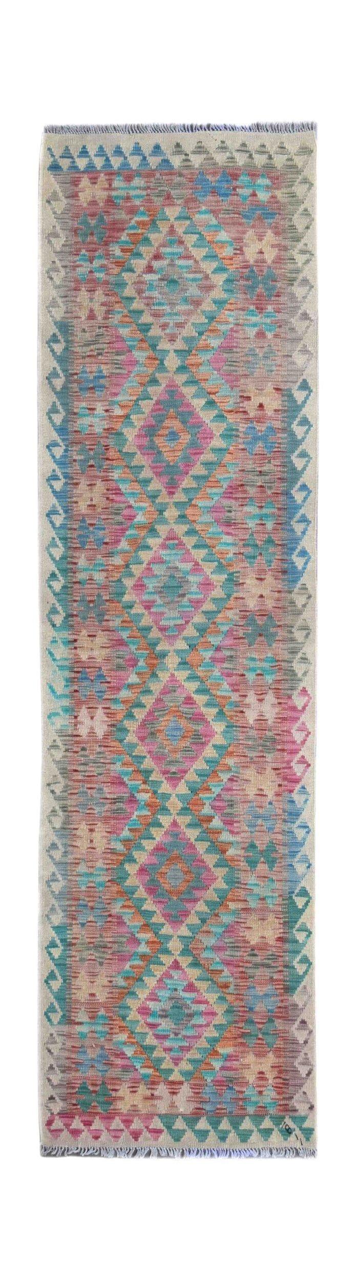 A handmade Afghan Maimana wool runner rug featuring a vibrant geometric diamond pattern.
