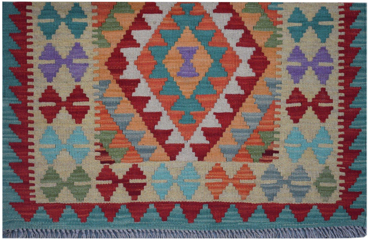 Handmade Afghan Maimana kilim runner featuring a colorful geometric diamond pattern.
