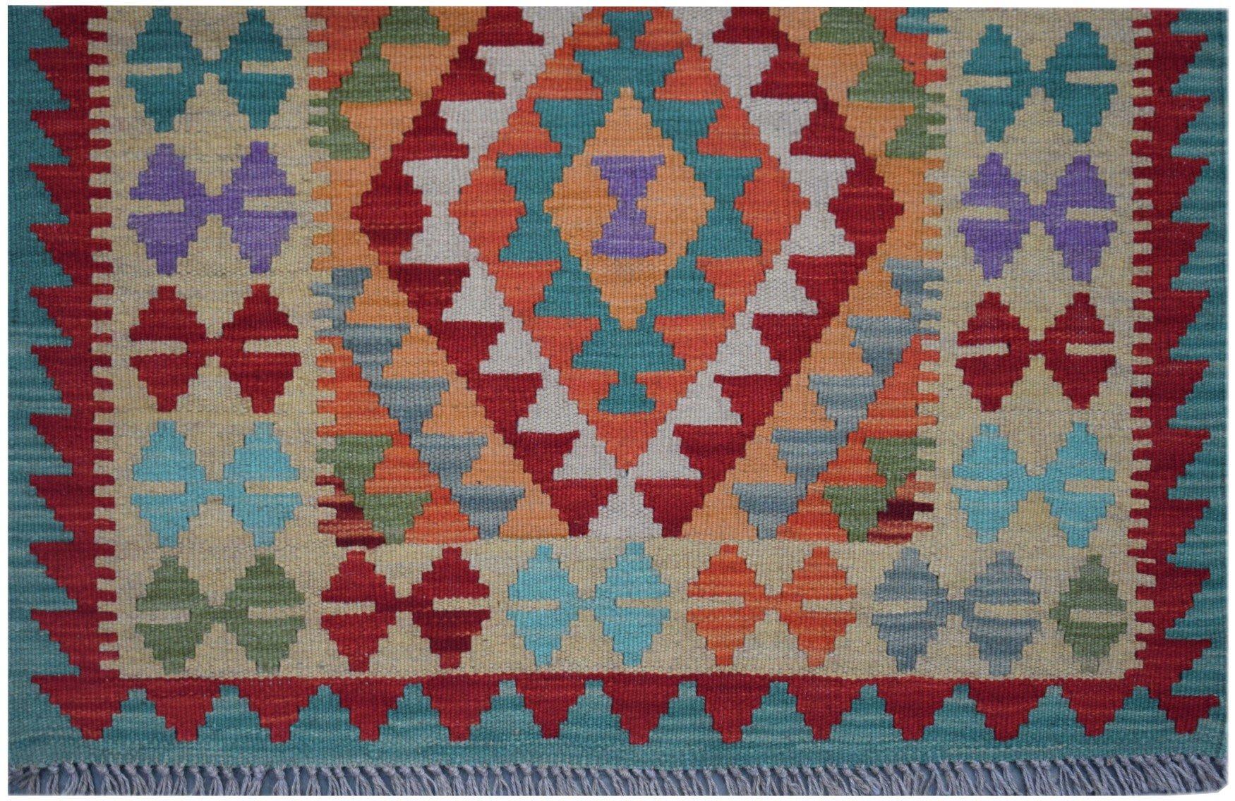 Handmade Afghan Maimana kilim runner featuring a colorful geometric diamond pattern.