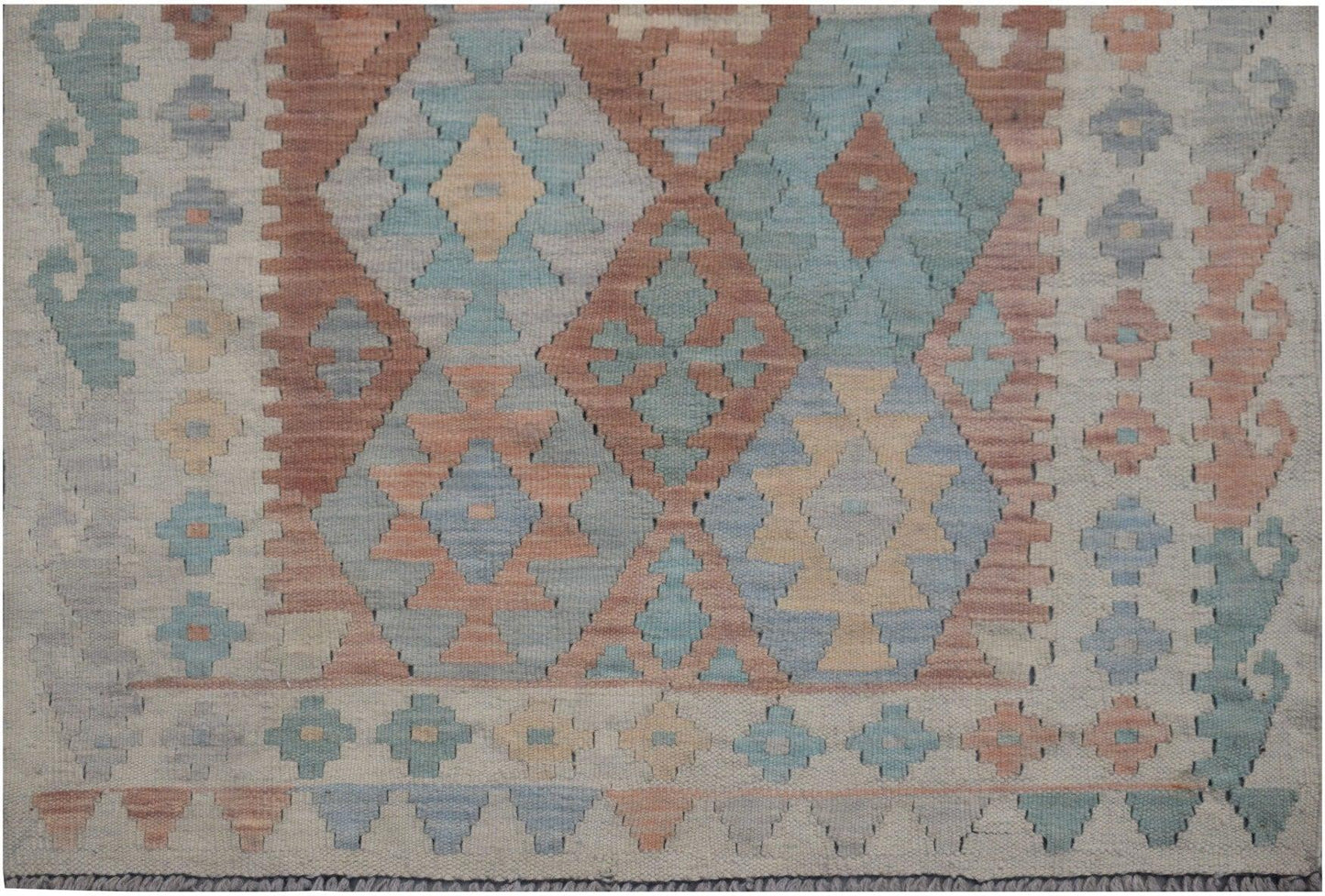 Handmade Afghan Maimana kilim runner featuring a geometric diamond pattern in muted earth tones.