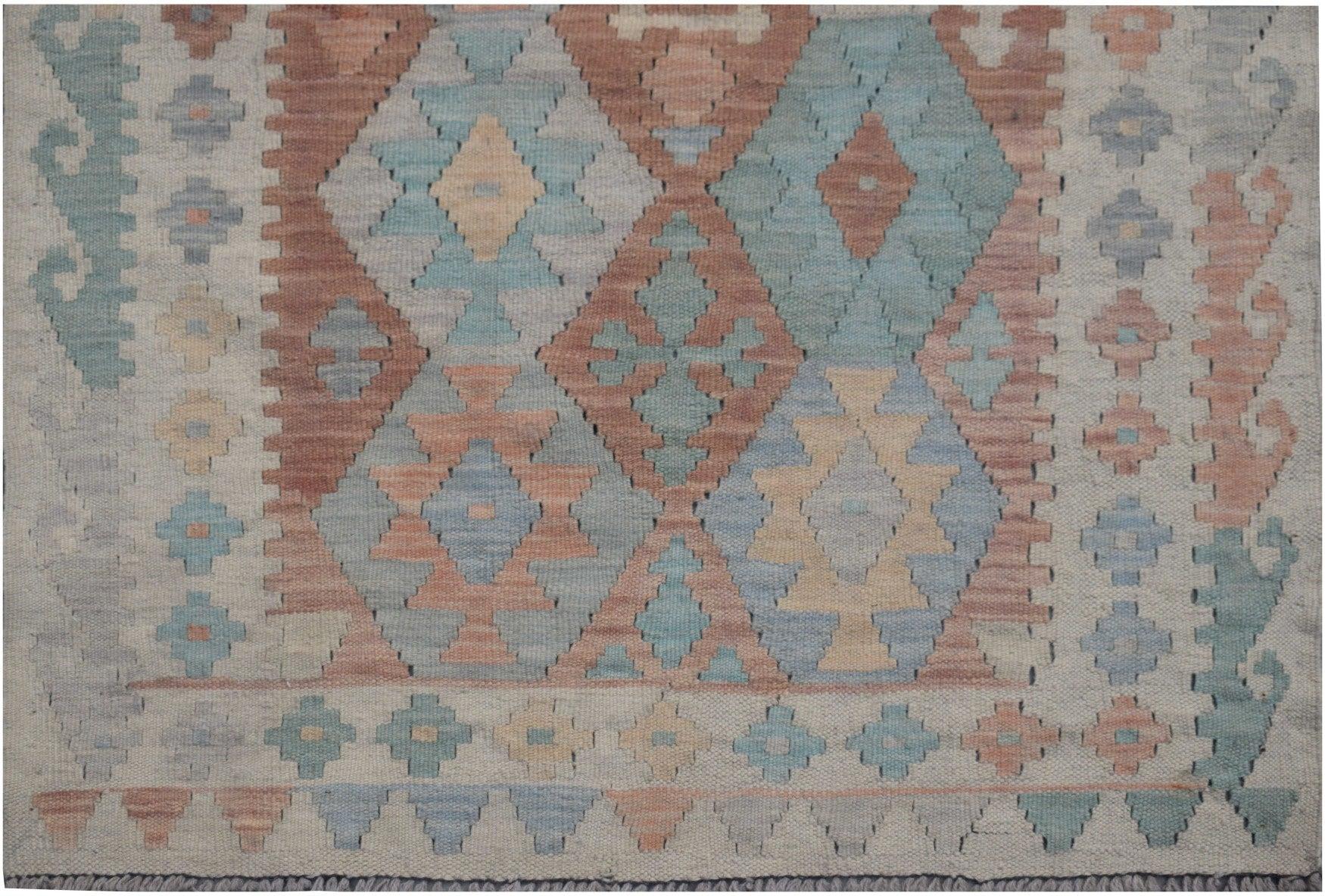 Handmade Afghan Maimana kilim runner featuring a geometric diamond pattern in muted earth tones.