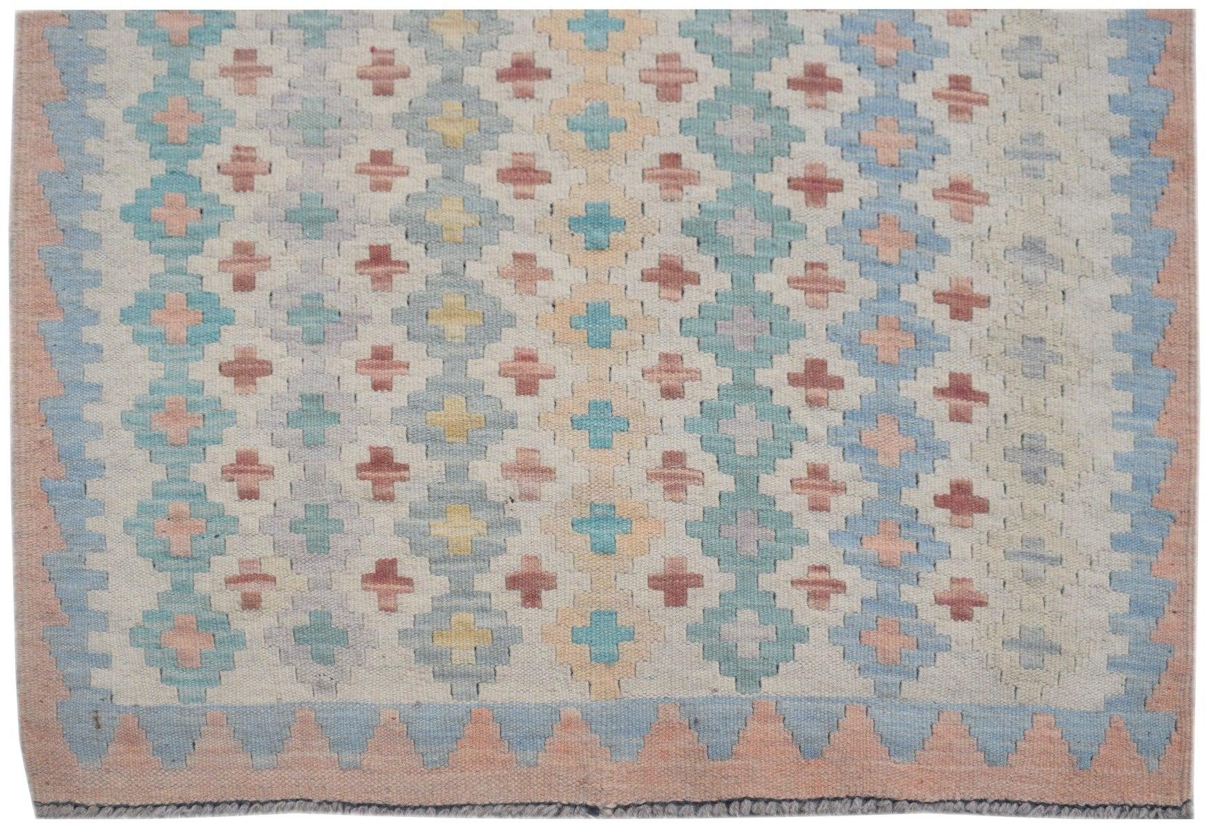 Handmade Afghan Maimana kilim runner featuring a geometric pattern in soft pastel colors.