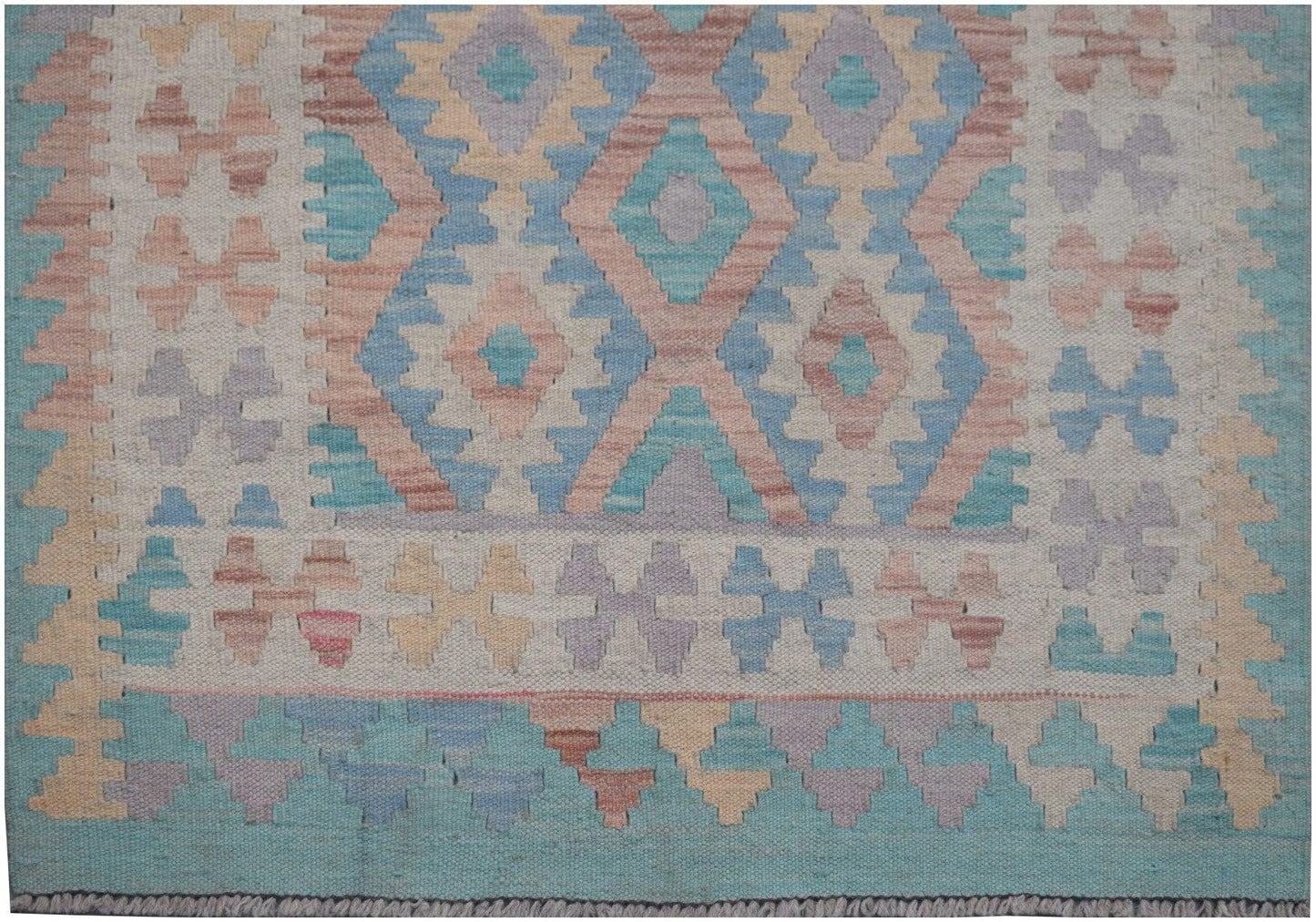 Handmade Afghan Maimana kilim runner featuring a geometric pattern in soft blue, pink, and tan.