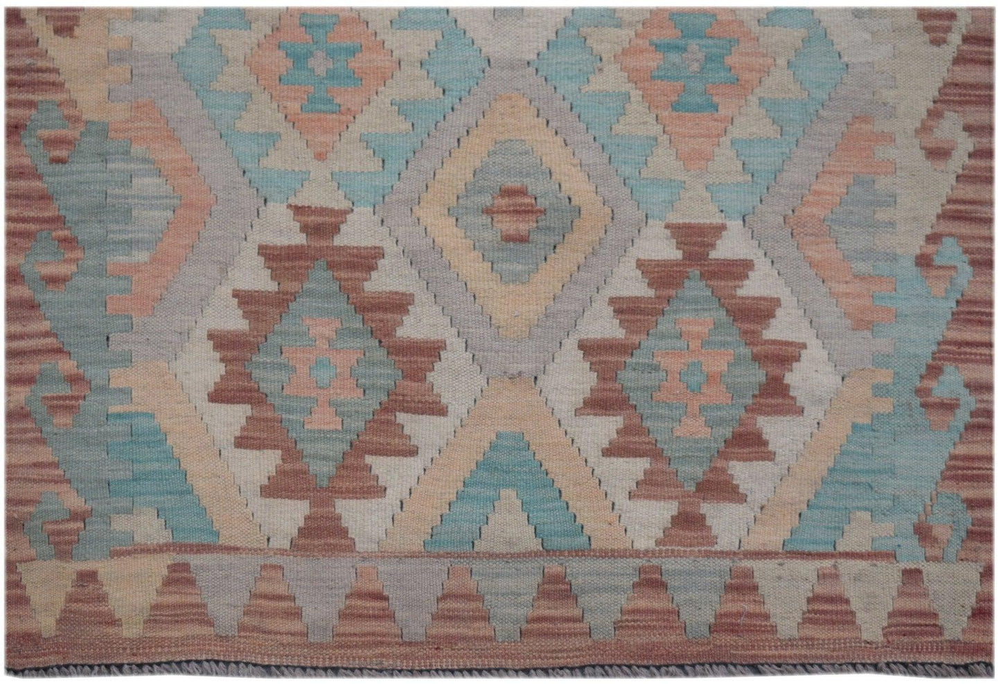 Handmade Afghan Maimana kilim runner featuring a geometric diamond pattern in muted earth tones.