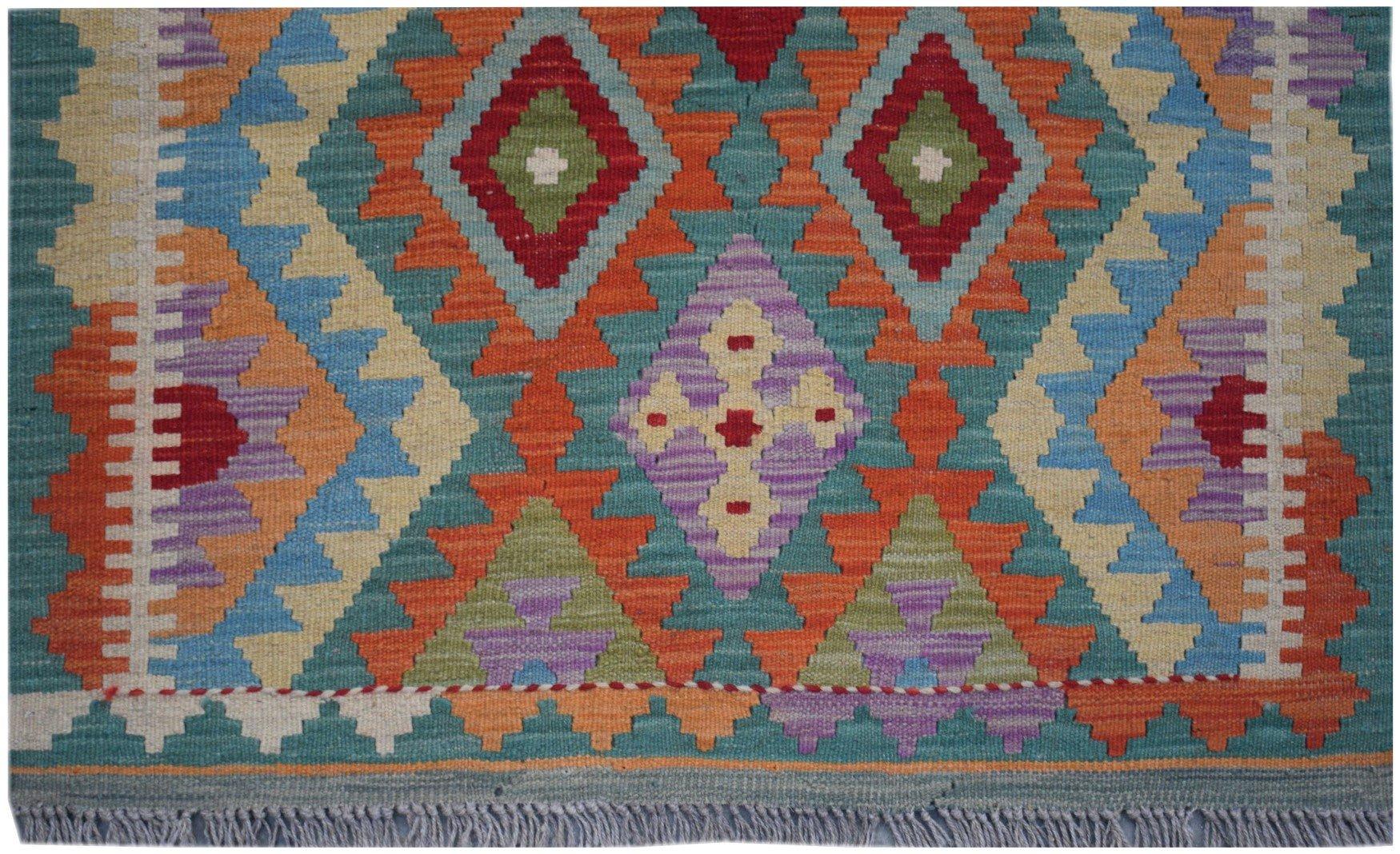 Handmade Afghan Maimana kilim runner featuring a colorful geometric diamond pattern.