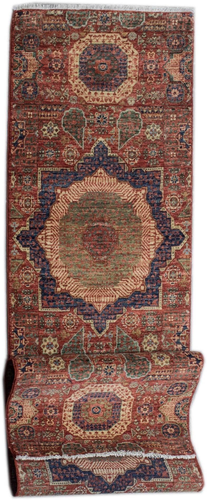 A handmade Afghan Chobi runner rug featuring a traditional Mamluk medallion design in red and blue.