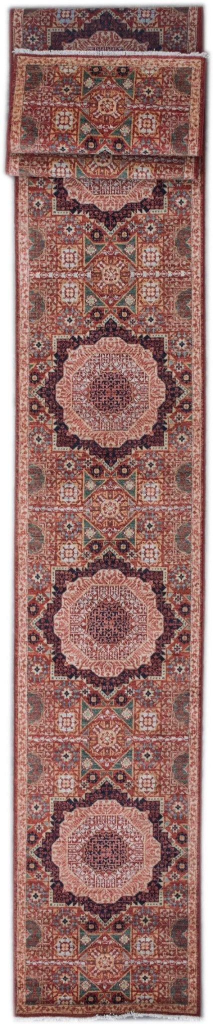 A handmade Afghan Chobi runner rug featuring a repeating Mamluk medallion pattern in warm tones.
