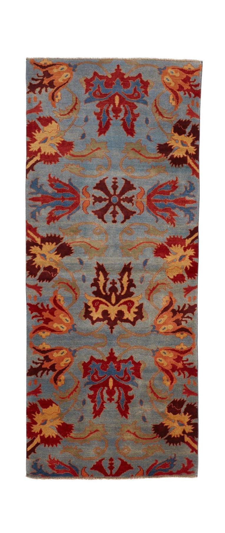 Handmade Afghan Chobi runner rug featuring a blue field with red and gold floral motifs.