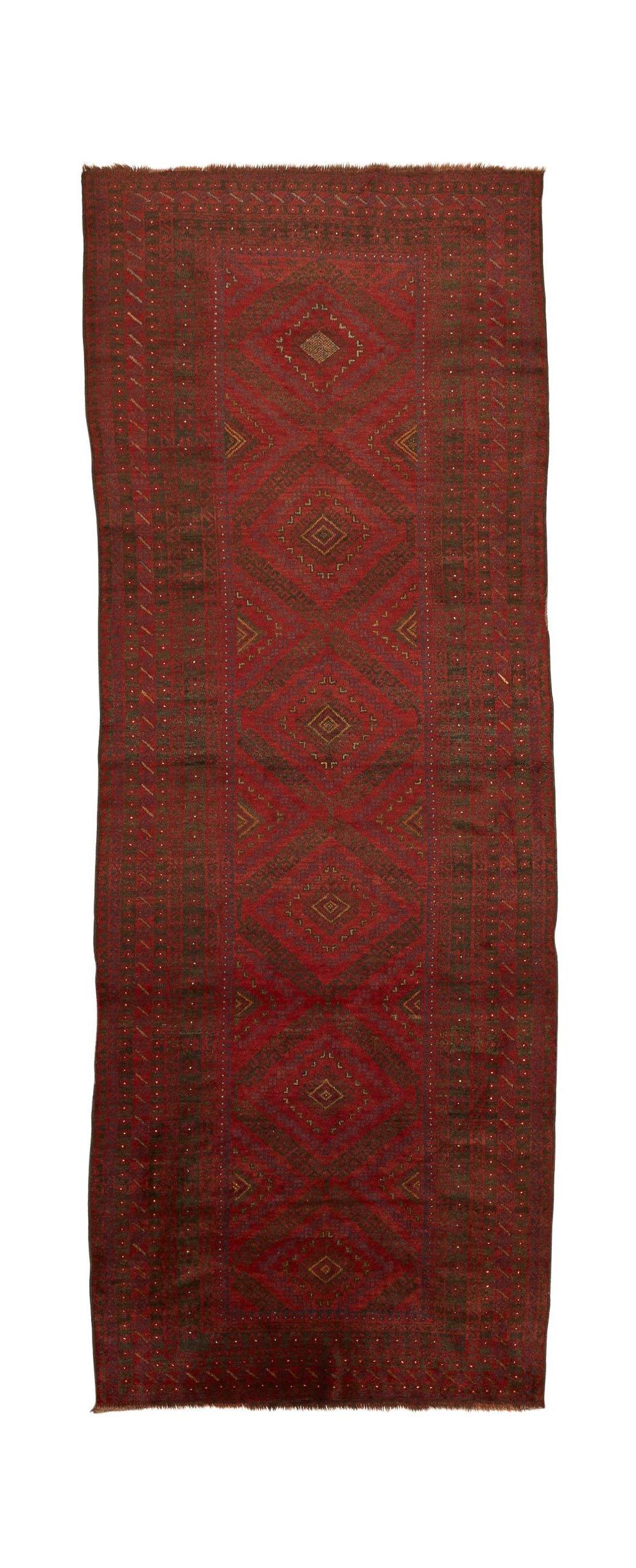 A vintage handmade Afghan Baluch runner featuring a repeating diamond pattern in deep red wool.