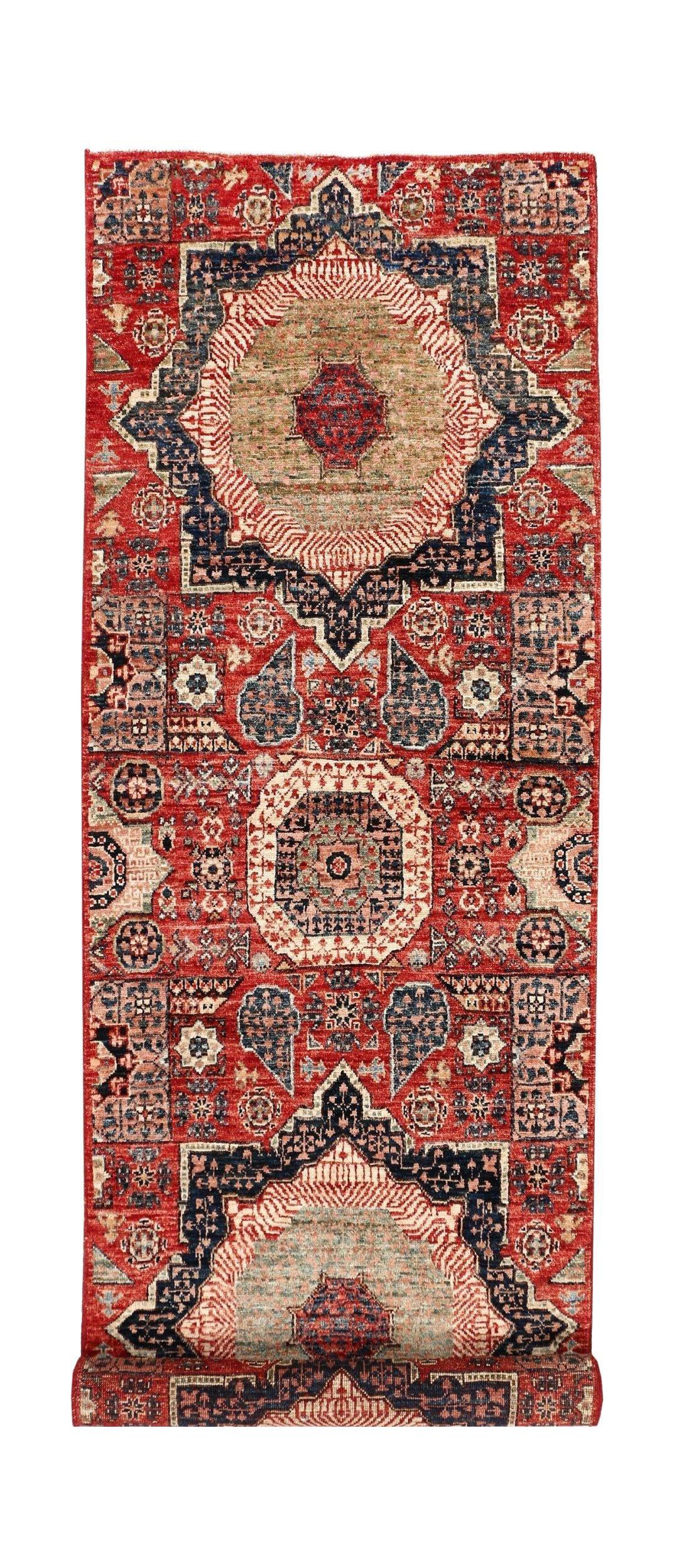 A handmade Afghan Chobi runner rug featuring a traditional Mamluk medallion design in red and blue.