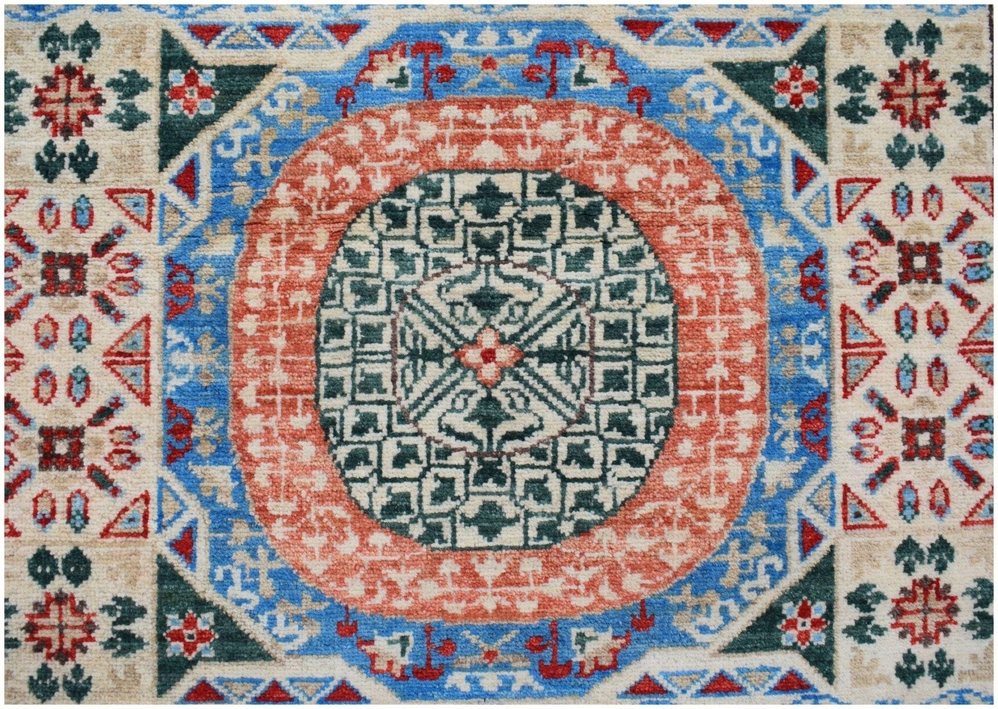A handmade Afghan Chobi runner featuring a complex geometric Mamluk medallion in red and green.