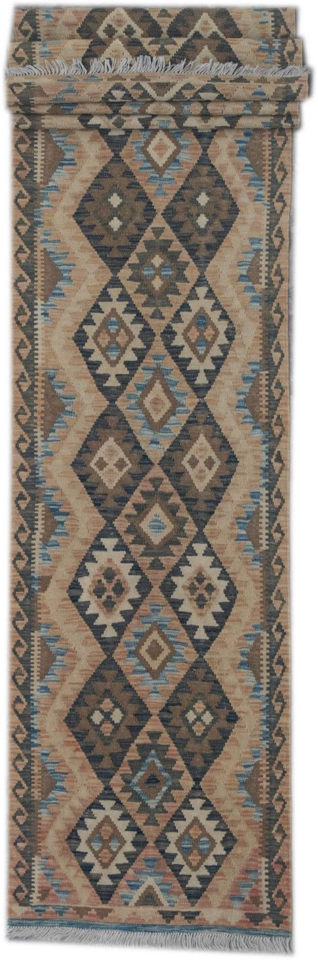 Handmade Afghan Maimana wool runner rug featuring a geometric diamond pattern in earthy tones.